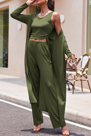 Army green ribbed knit duster, crop tank, and wide-leg pants set with drawstring detail.