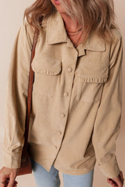 Tan corduroy utility shirt with ruffled chest pockets and button front.