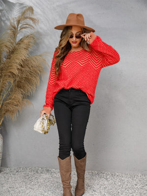 Chevron knit crewneck sweater in red with a fuzzy texture and crew neckline.