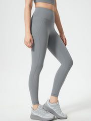 Gray sculpted contour leggings with pocket detail and athletic shoes.