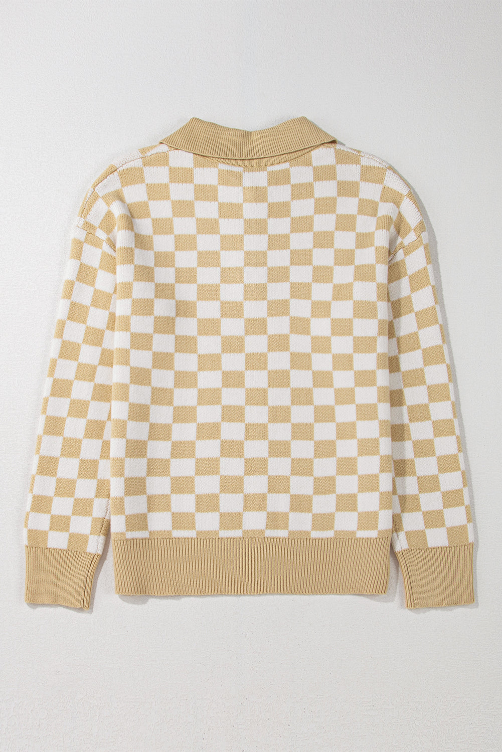 Tan and white checkerboard knit polo sweater with ribbed collar, cuffs, and hem.