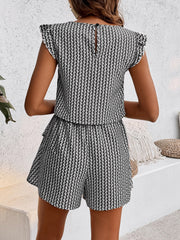 Black and white houndstooth co-ord set with ruffle sleeve top and shorts.