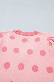 Pink polka dot knit cardigan with puff sleeves and crew neck