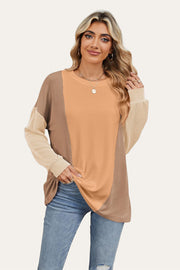 Colorblock waffle knit pullover sweater in tan, peach, and brown with crew neck and long sleeves.