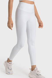 White seamless high-waist performance leggings with a sculpted fit and subtle side seam detail.