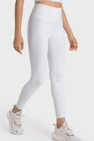 White seamless high-waist performance leggings with a sculpted fit and subtle side seam detail.