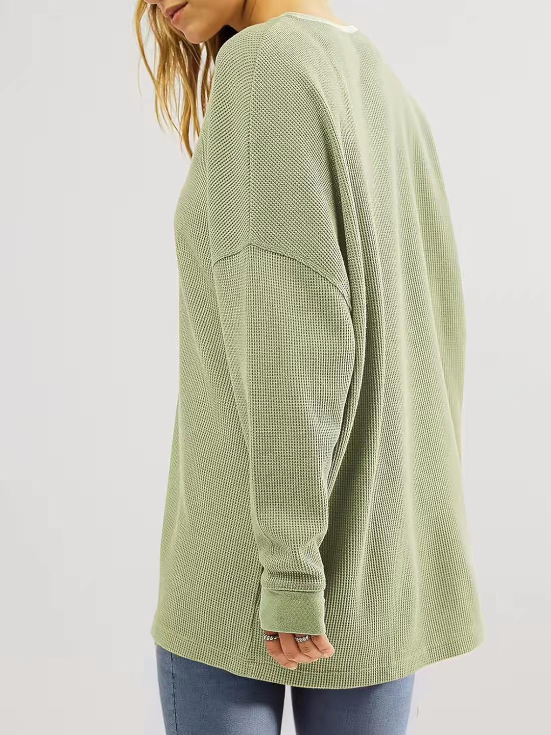 Sage waffle knit raglan sleeve sweatshirt with crew neck and cuffed sleeves.