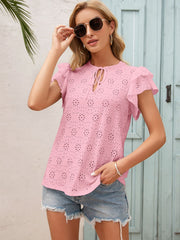 Blush pink eyelet blouse with ruffle sleeves and keyhole neckline.