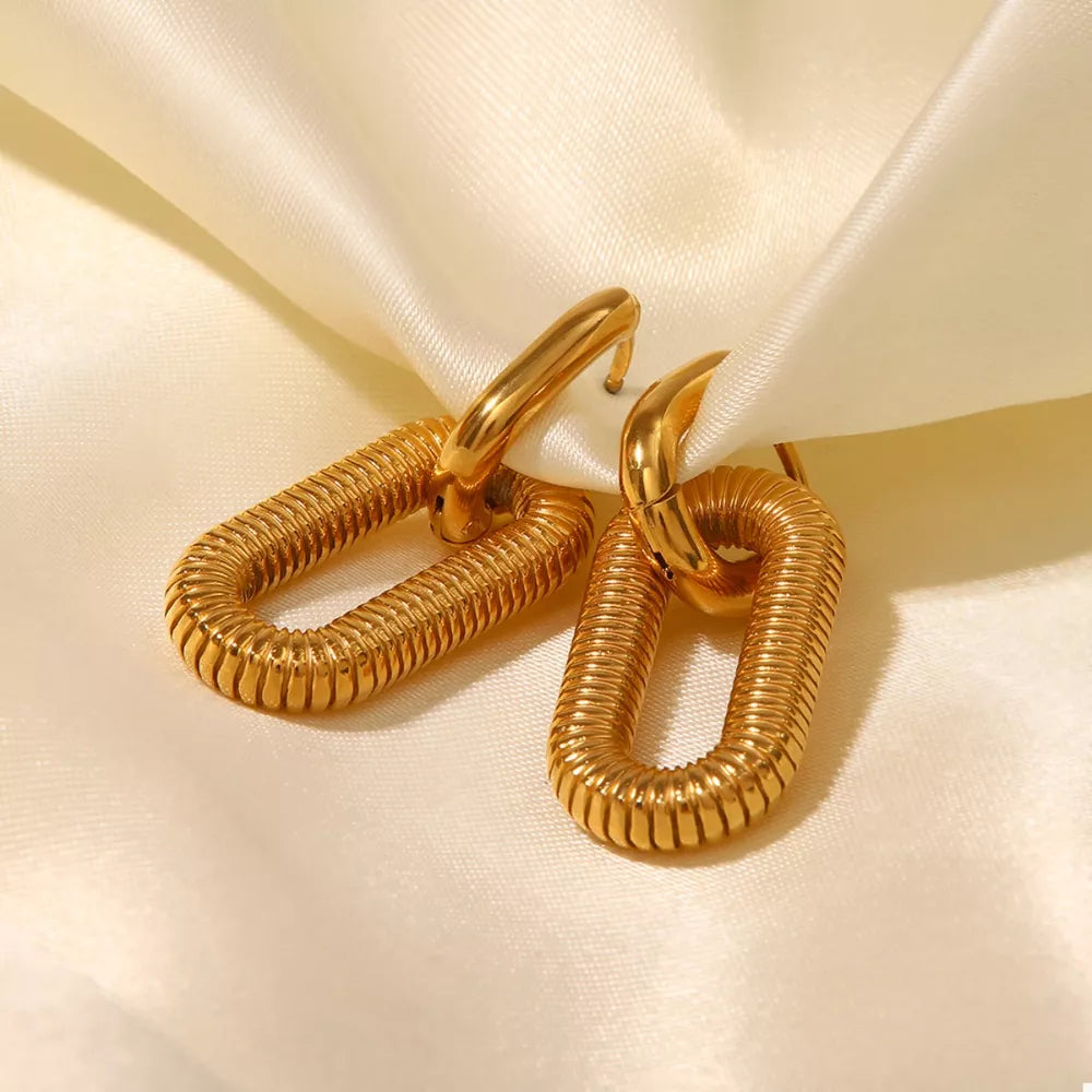 Gold link drop earrings with ribbed oval pendant, 18k gold finish.