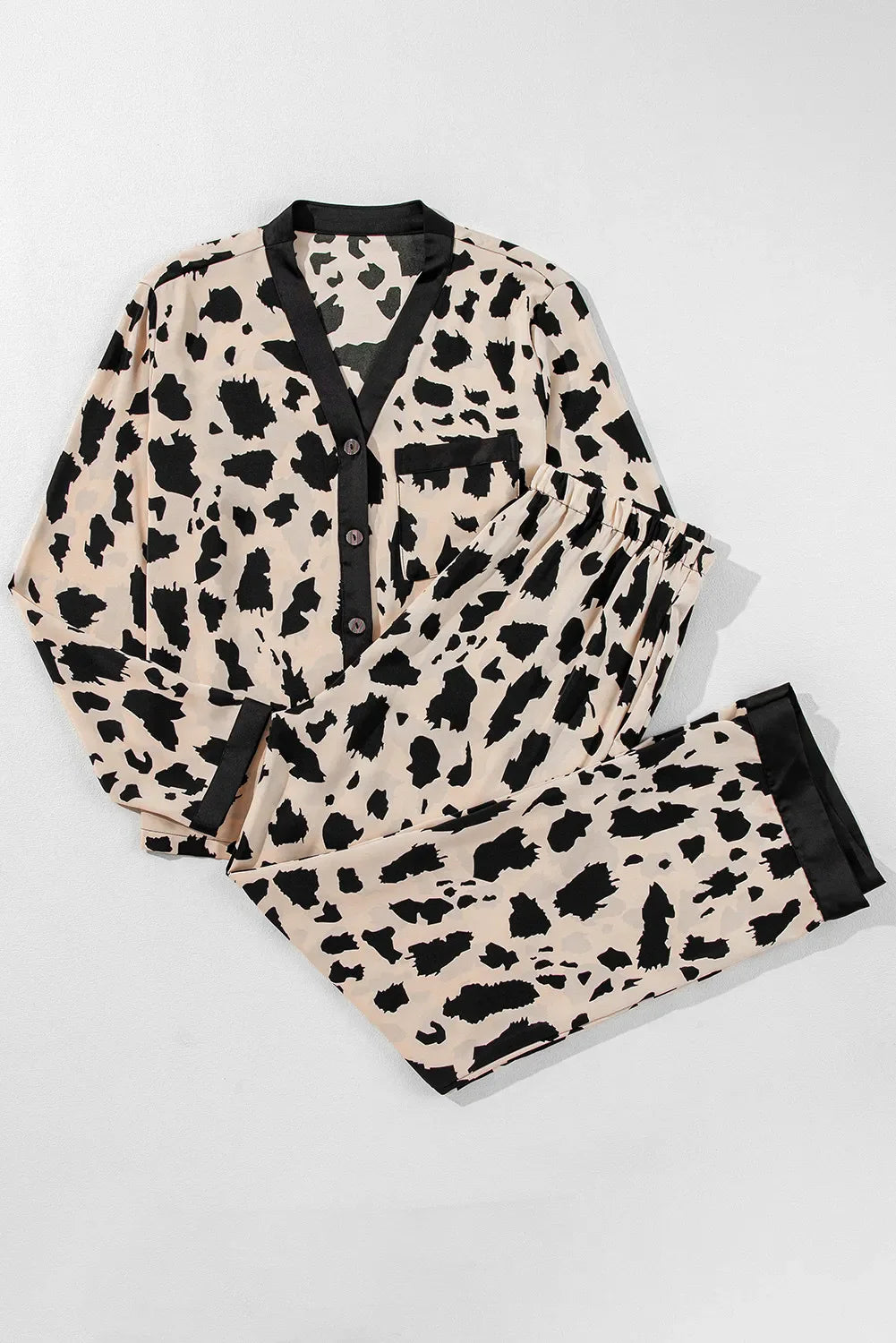 Animal print satin pajama set with button front top and drawstring pants in leopard.