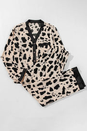Animal print satin pajama set with button front top and drawstring pants in leopard.