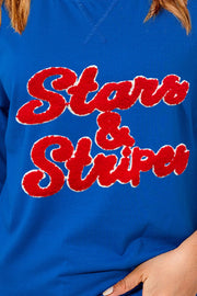 Royal blue slouch tee with red embroidered Stars & Stripes graphic.