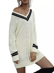 Beige V-neck cable knit sweater dress with black stripe details on neckline and cuffs.