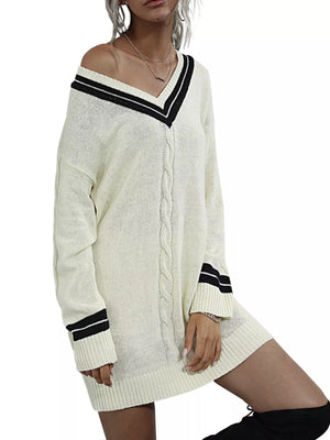 Beige V-neck cable knit sweater dress with black stripe details on neckline and cuffs.