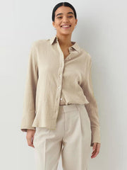 Beige textured cotton overshirt with relaxed fit and button front.