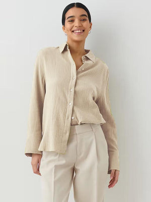 Beige textured cotton overshirt with relaxed fit and button front.