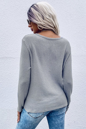 Gray waffle knit long sleeve top with knot detail, crew neck, casual fit.