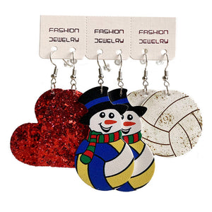 Festive sports trio earrings set with red glitter heart, snowmen, and volleyball designs.