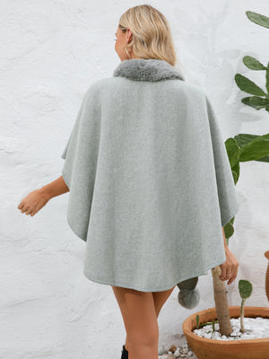Gray faux fur collar wrap poncho with a pom-pom detail.