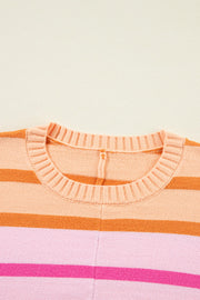 Ombre stripe knit sweater in sherbet with ribbed crew neck and horizontal stripes.
