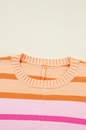Ombre stripe knit sweater in sherbet with ribbed crew neck and horizontal stripes.