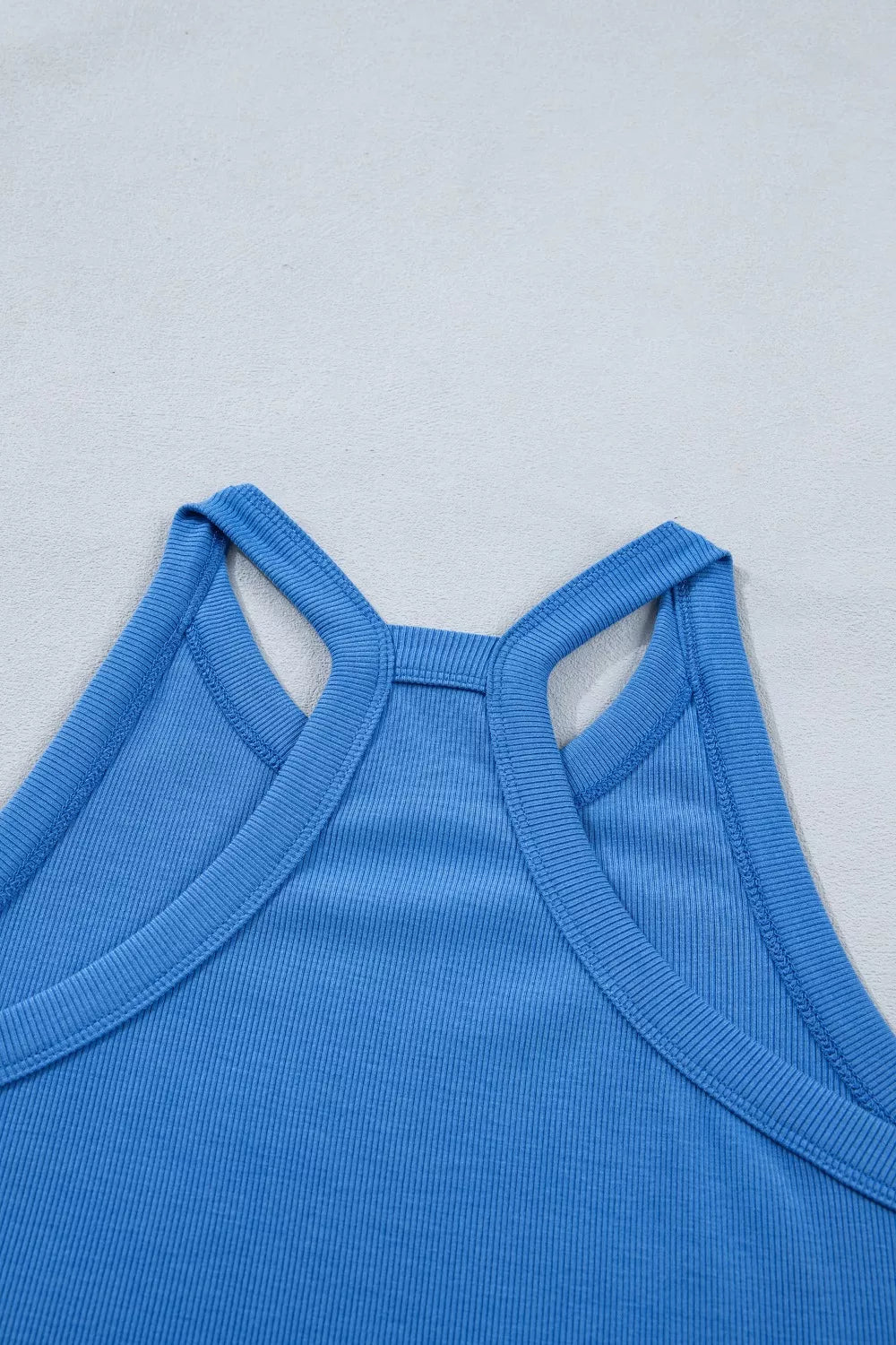 Blue ribbed cropped tank top with racerback detail