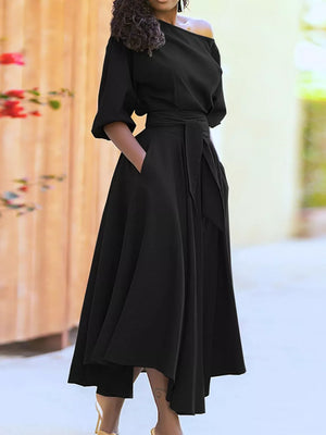Black off-the-shoulder belted dress with elbow sleeves and pockets.