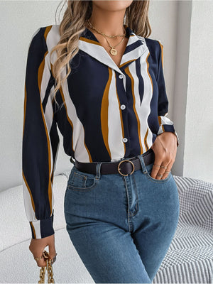 Collared blouse with wavy stripes in dark blue, white, and mustard yellow, button-front, long sleeves.