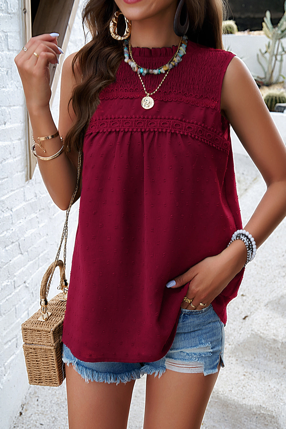 Wine textured yoke dot tank top with smocked neckline and lace trim detail.
