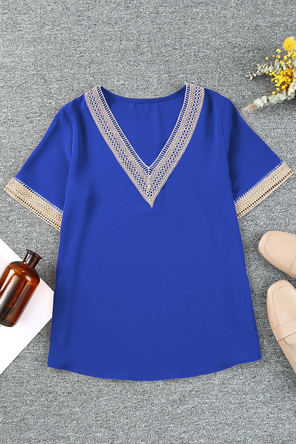 Royal blue V-neck blouse with lace trim on neckline and sleeves.