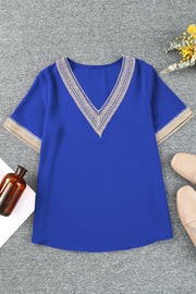 Royal blue V-neck blouse with lace trim on neckline and sleeves.