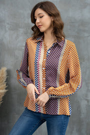 Geometric print blouson sleeve blouse with button front and collared neckline.