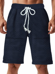 Navy blue quilted texture drawstring chino shorts for men with diamond pattern.