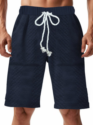 Navy blue quilted texture drawstring chino shorts for men with diamond pattern.
