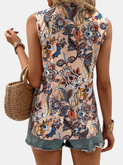 Paisley Bloom Sleeveless Blouse in Tan with a vibrant floral print, featuring a mock neck and sleeveless design.
