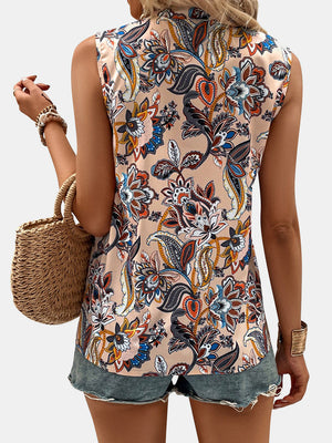 Paisley Bloom Sleeveless Blouse in Tan with a vibrant floral print, featuring a mock neck and sleeveless design.