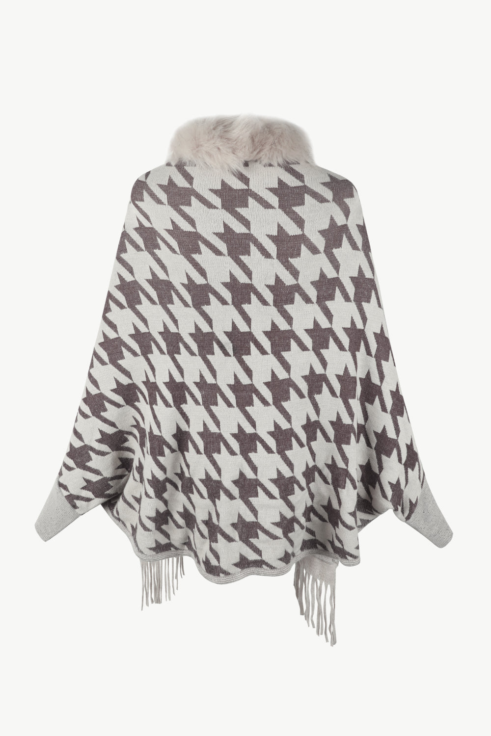 Houndstooth knit poncho with faux fur collar and fringe trim