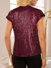 Burgundy sequin cap sleeve blouse with satin trim.