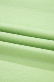 Lime cotton loungewear fabric detail showing soft texture and relaxed fit