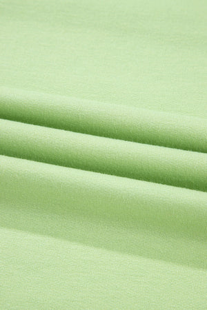 Lime cotton loungewear fabric detail showing soft texture and relaxed fit