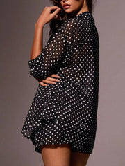 Black sheer polka dot two-piece set with a relaxed fit and short sleeves.