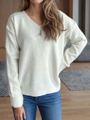 White relaxed-fit V-neck knit sweater with ribbed hem and cuffs