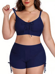 Navy plus size adjustable swimwear set with drawstring tie-front top and ruched drawstring shorts.