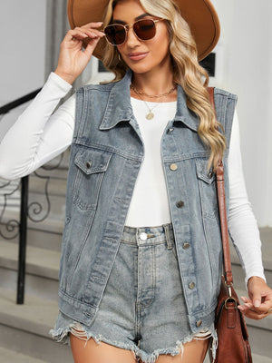 Denim vest with button front and hooded back detail, medium wash.