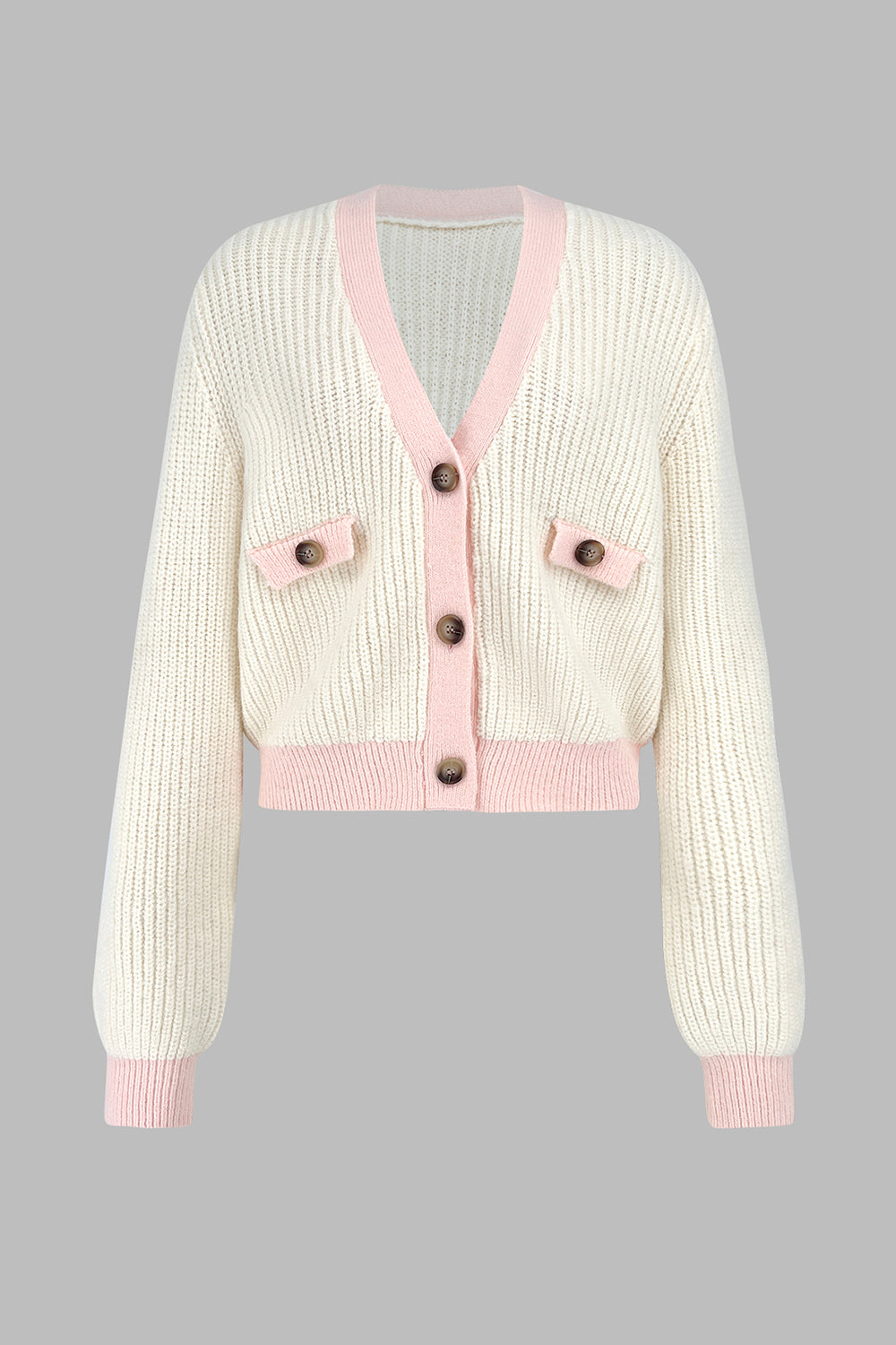 Cream cropped knit cardigan with pink trim and buttoned pockets