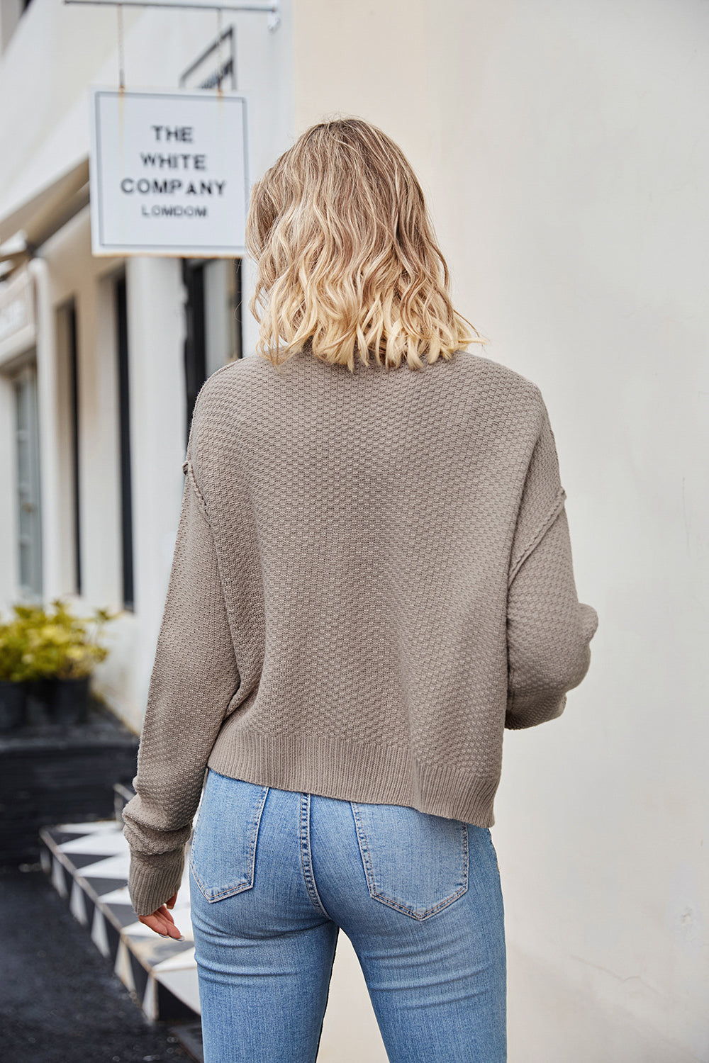 Textured knit cropped cardigan in mocha with button details.