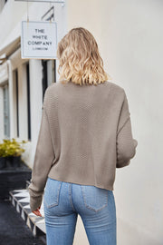 Textured knit cropped cardigan in mocha with button details.