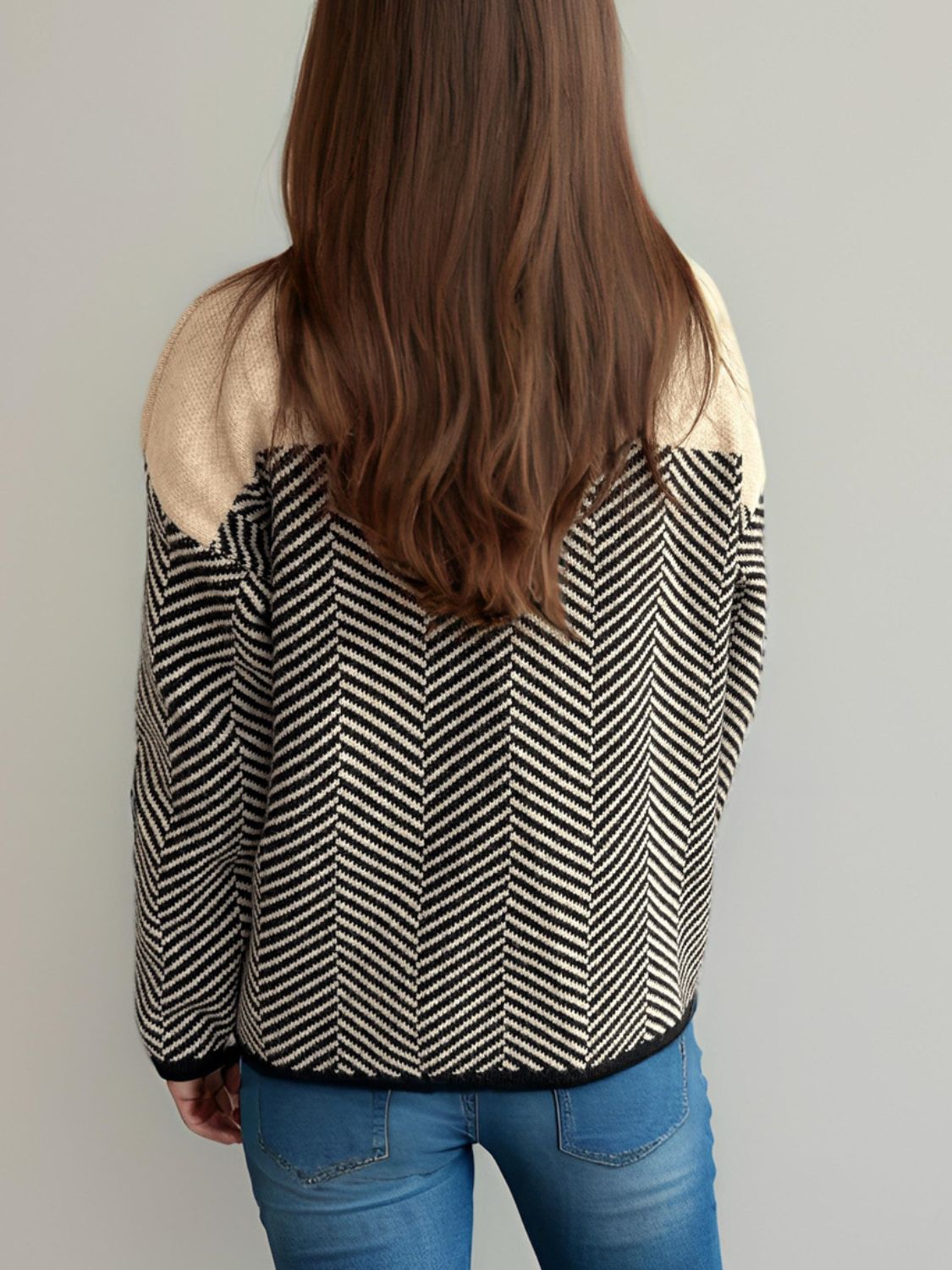 Chevron knit sweater with colorblock tan shoulders and black/white chevron pattern.