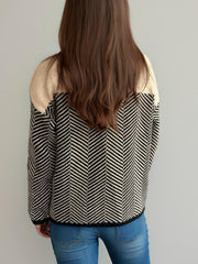Chevron knit sweater with colorblock tan shoulders and black/white chevron pattern.