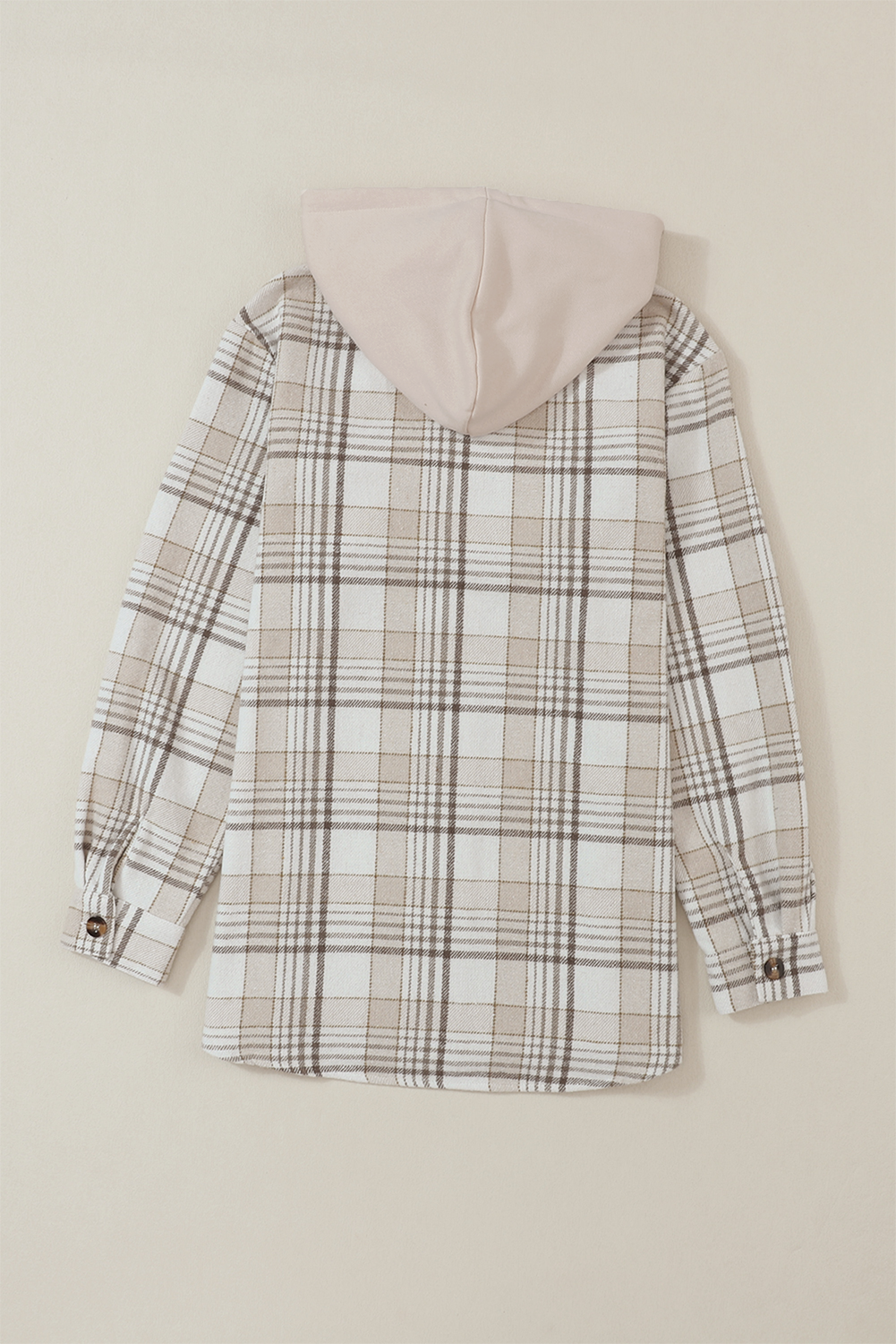 Oversized plaid shacket with attached beige hoodie and button cuffs.